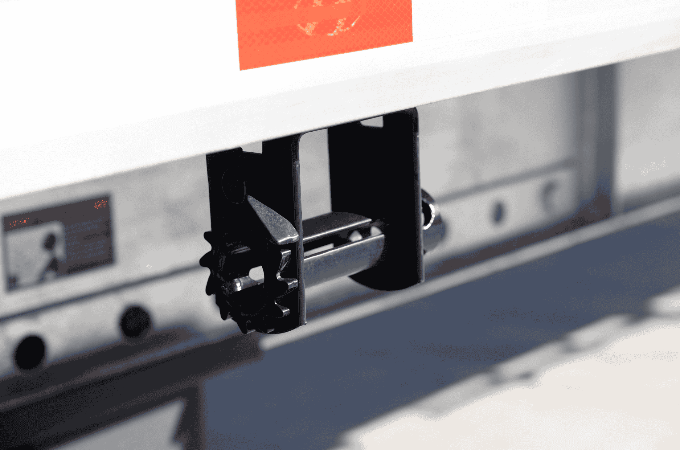 Close-up of a tie-down winch mechanism on a Hyundai Translead trailer, highlighting the robust engineering and trailer technology for secure cargo management.